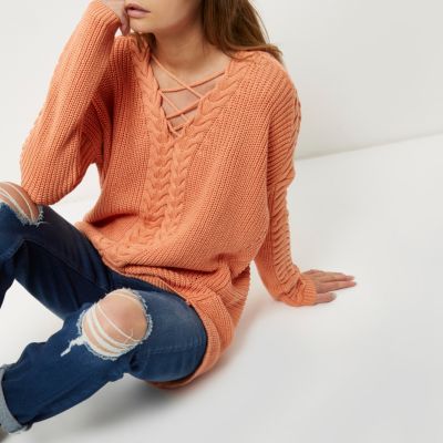Coral cable knit lace-up front jumper